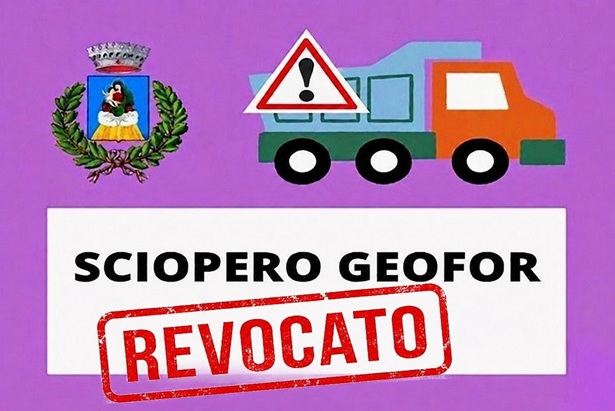 Scritta con logo del Comune e camion